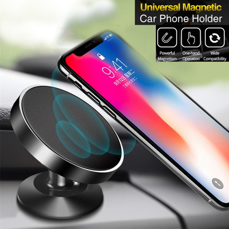 Black universal magnetic car phone navigation bracket holding a phone on dashboard