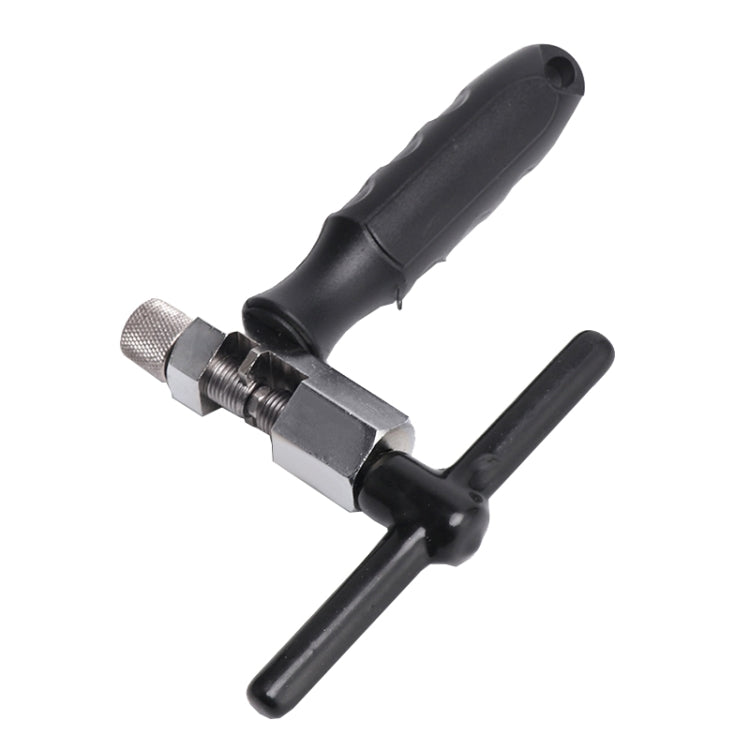 Bicycle chain repair tool close-up with knurled screw adjuster and black grips