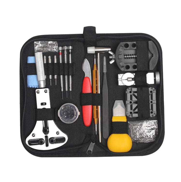 Black watch repair tool kit bag opened to show tools, bits, and accessories in slots