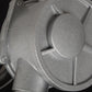 Silver alloy oil pump head with round cap and internal valve details