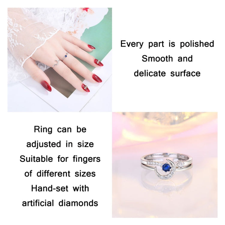 Adjustable silver-tone open ring with blue center stone and clear crystal accents