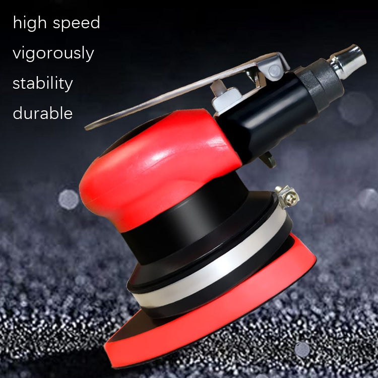 Red and black pneumatic polishing machine with rotating buffing pad