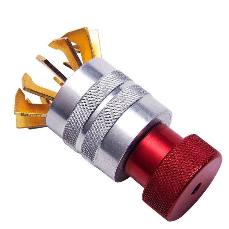 Watch bezel opener tool with gold prongs and red-and-silver grip