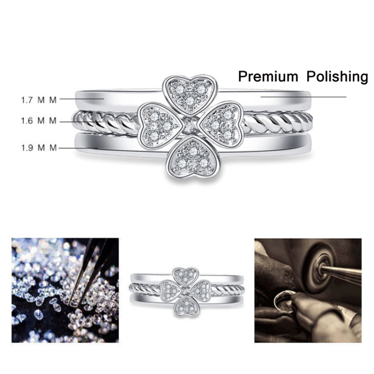 Silver open adjustable four-leaf clover ring with heart-shaped crystal stone design