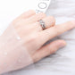 Silver open adjustable four-leaf clover crystal ring on finger
