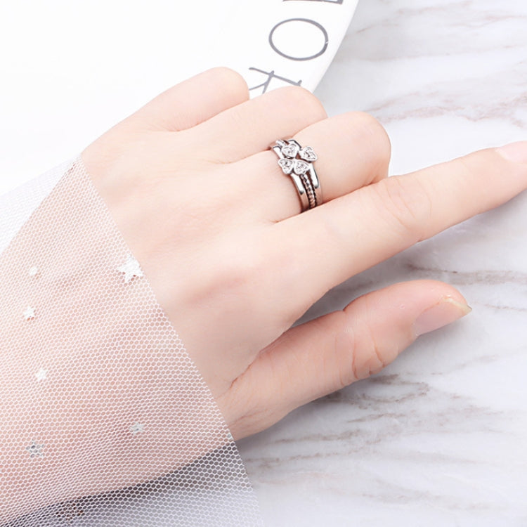 Silver open adjustable four-leaf clover crystal ring on finger