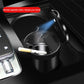Car ashtray with LED ambient light, open tray with cigarette and hinged lid.