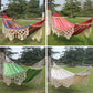 Double hammock with striped fabric, cream macrame net, and long tassel fringe.