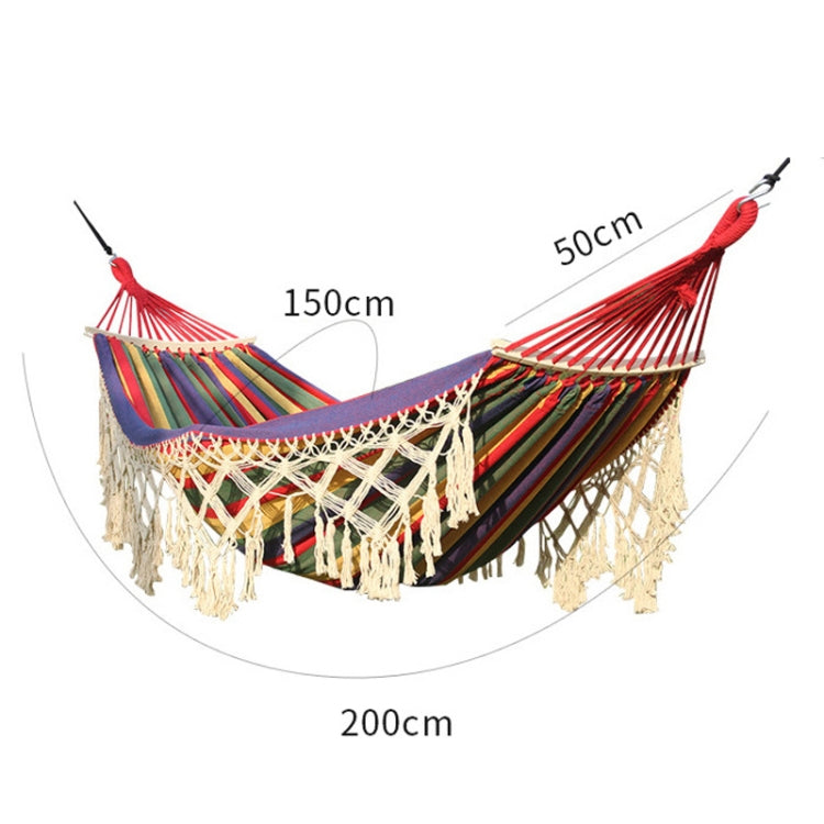 Double canvas hammock with multicolor stripes, cream macrame net, and red end ropes.