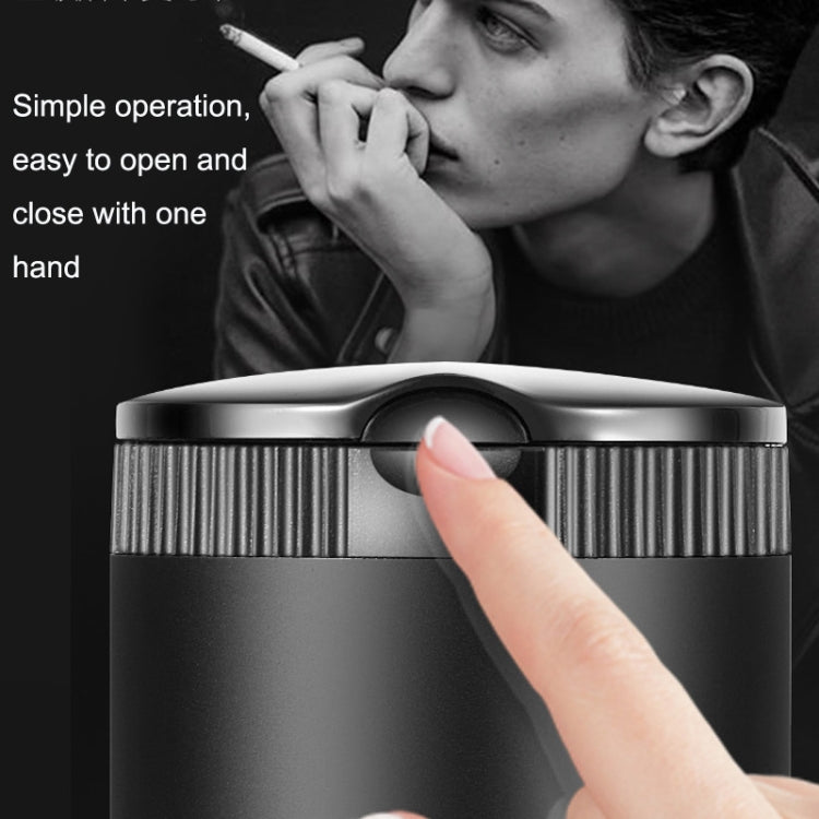 Two-tone LED car ashtray with cover, hand pressing lid on silver top and dark body