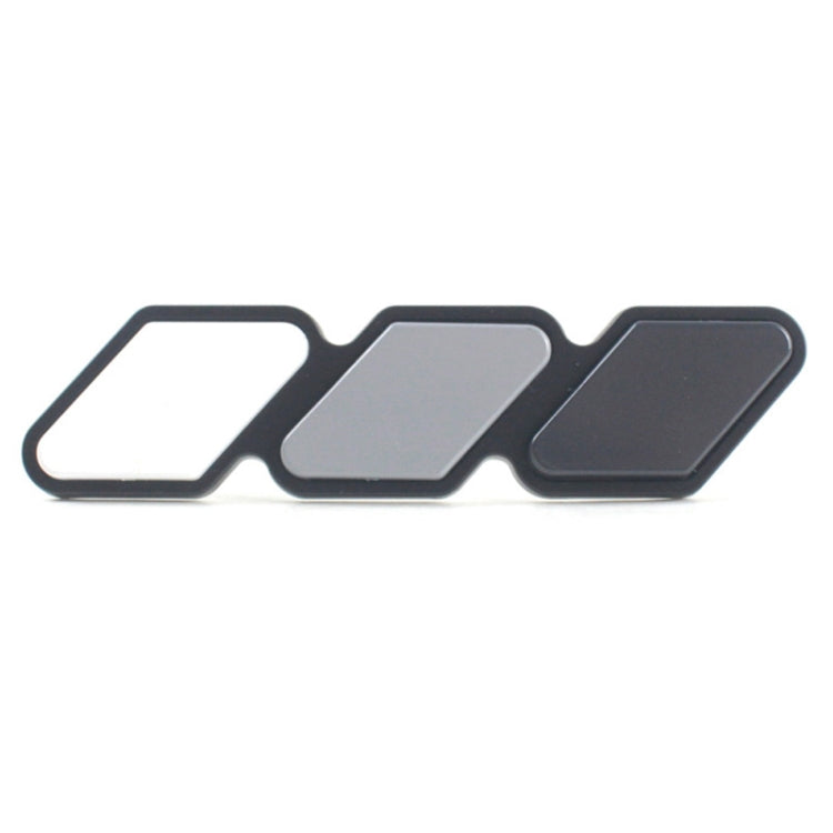 Three-piece car decal set with white, light gray, and dark gray arrow shapes