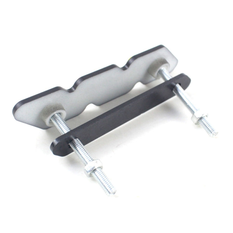 Car mounting bracket with gray bar, black base, and four screws
