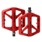 Red MEROCA mountain bike nylon pedal pair with threaded axles and grip pins
