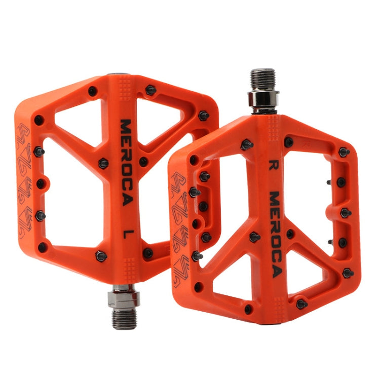 Orange MEROCA mountain bike nylon pedal pair with threaded axles and grip pins