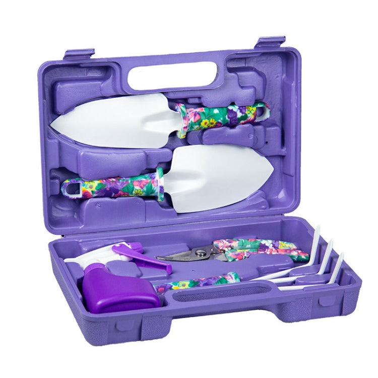 Purple potted gardening tool set open with floral-pattern handles and shovels