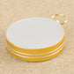 Gold metal compass base with white top cover and keyring loop.