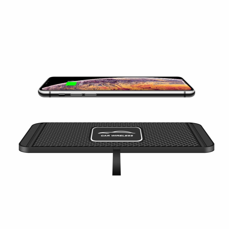 Black anti-slip wireless charging pad with phone resting on top for charging