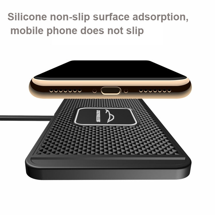 Car wireless charger pad with textured non-slip surface holding a phone