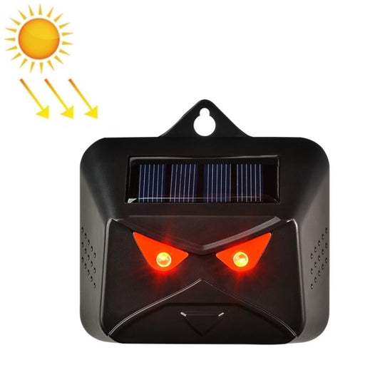 Solar animal repeller with black housing, top solar panel, and red flashing LEDs