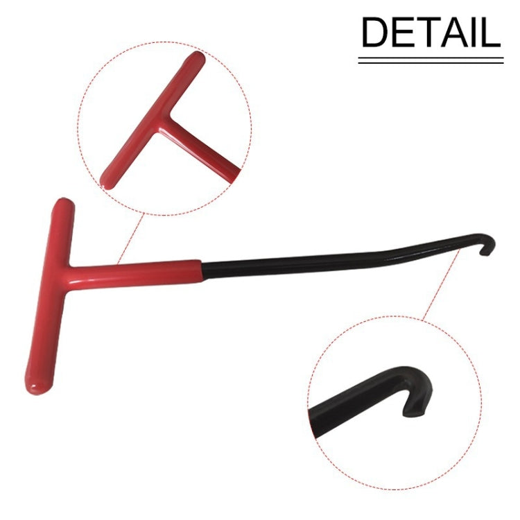 Exhaust pipe spring hook tool detail with red handle and black curved hook