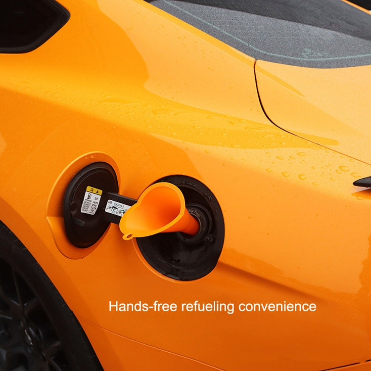 Orange funnel inserted into vehicle fuel filler port opening