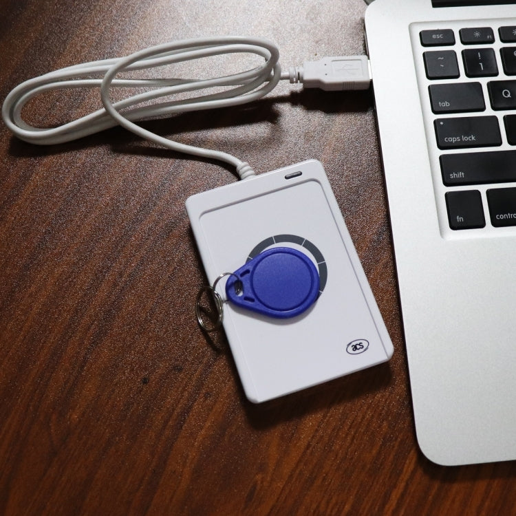 Contactless IC card reader with blue key fob and white USB cable