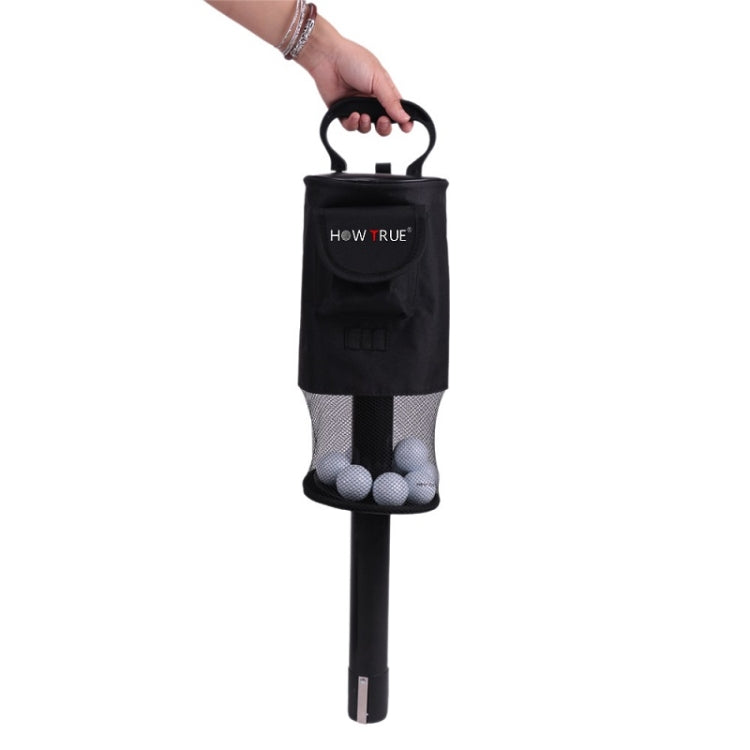 Black golf ball picker held by handle, with mesh bag for balls