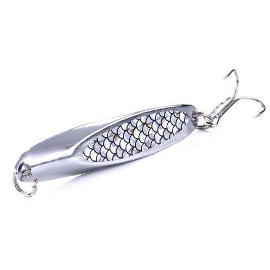 Silver fishing lure with white scale-pattern oval sequin body and two treble hooks