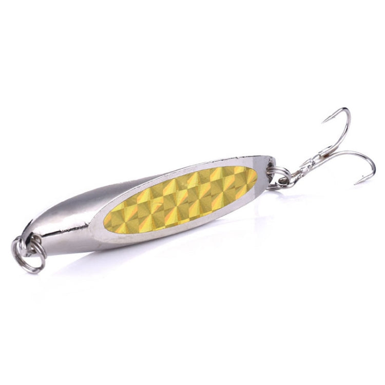 Silver fishing lure with yellow textured oval sequin body and two treble hooks