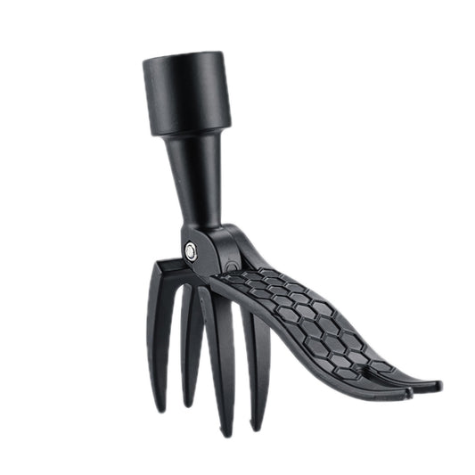 Black manual vertical foot weeding tool with barbed claws for weeding between plants