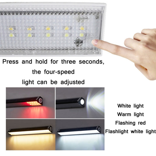 Solar LED light bar face with control switch area, shown with hand