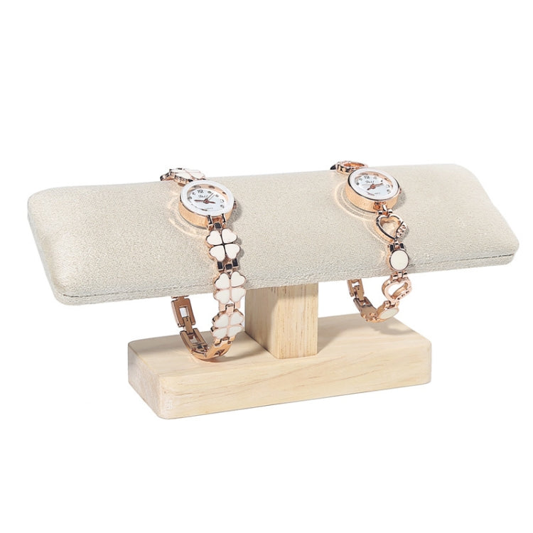 T-shaped jewelry display stand with beige fabric padded bar and light wood base, for watches