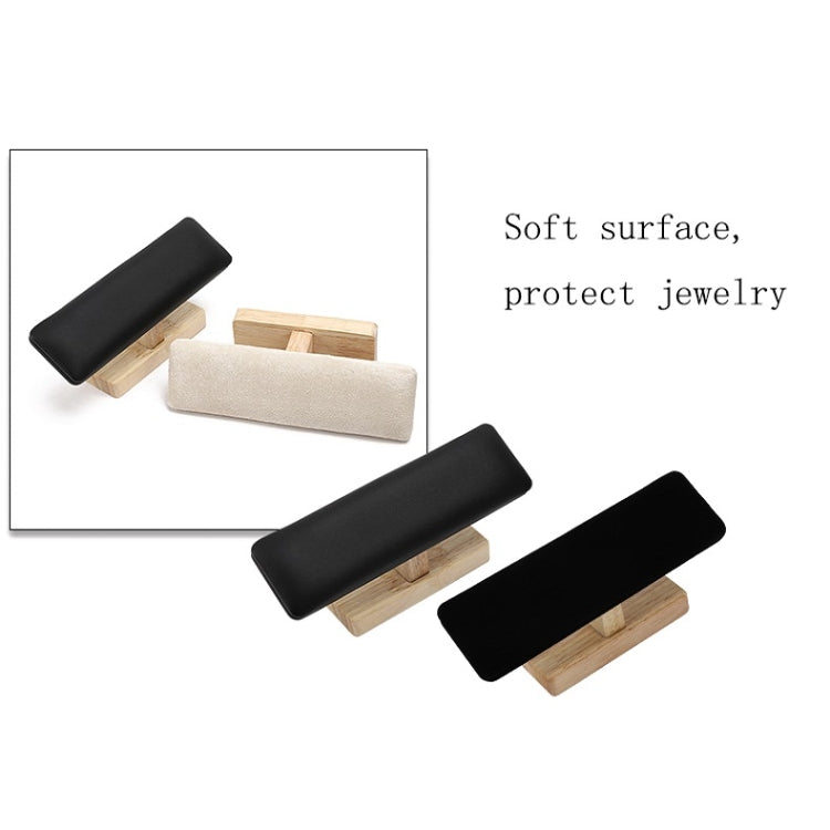 T-shaped jewelry display stands with black and beige/white padded bars and light wood bases