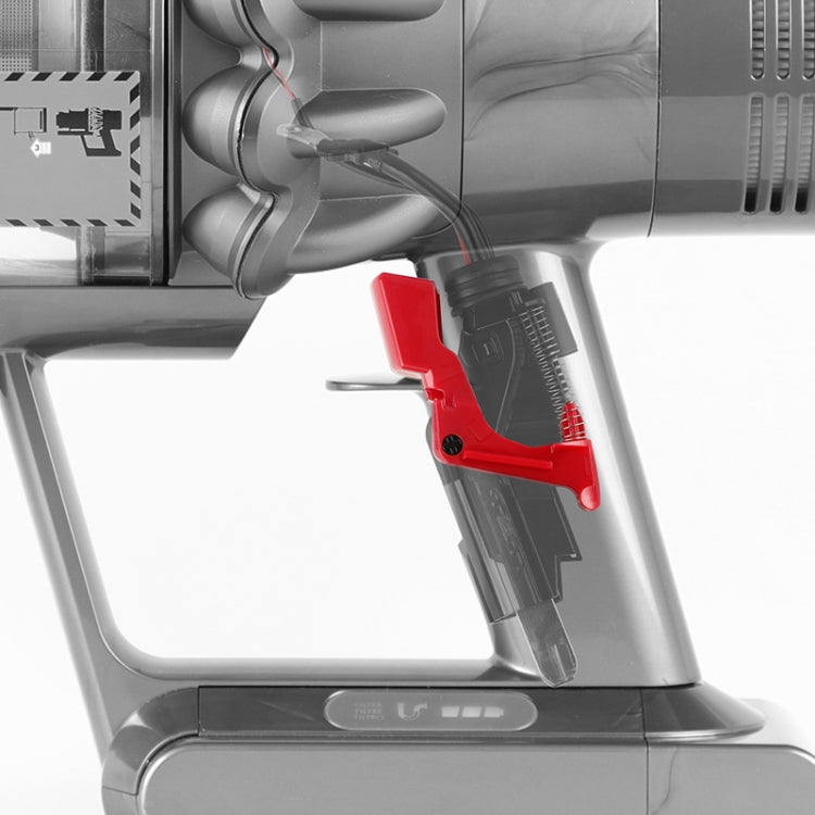Red switch lock key button on vacuum accessory, side view