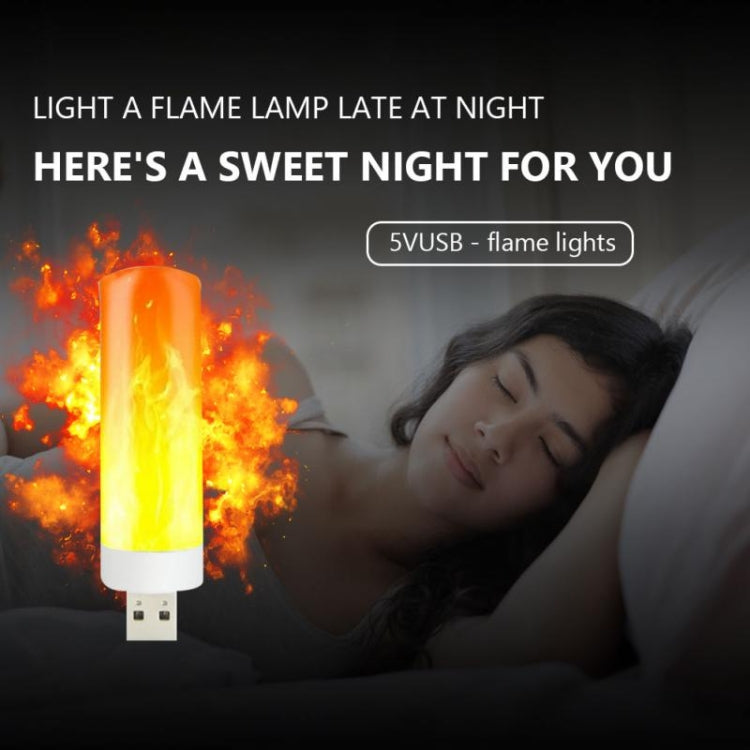 USB LED flame lamp on a bedside setting, glowing orange-yellow flame effect