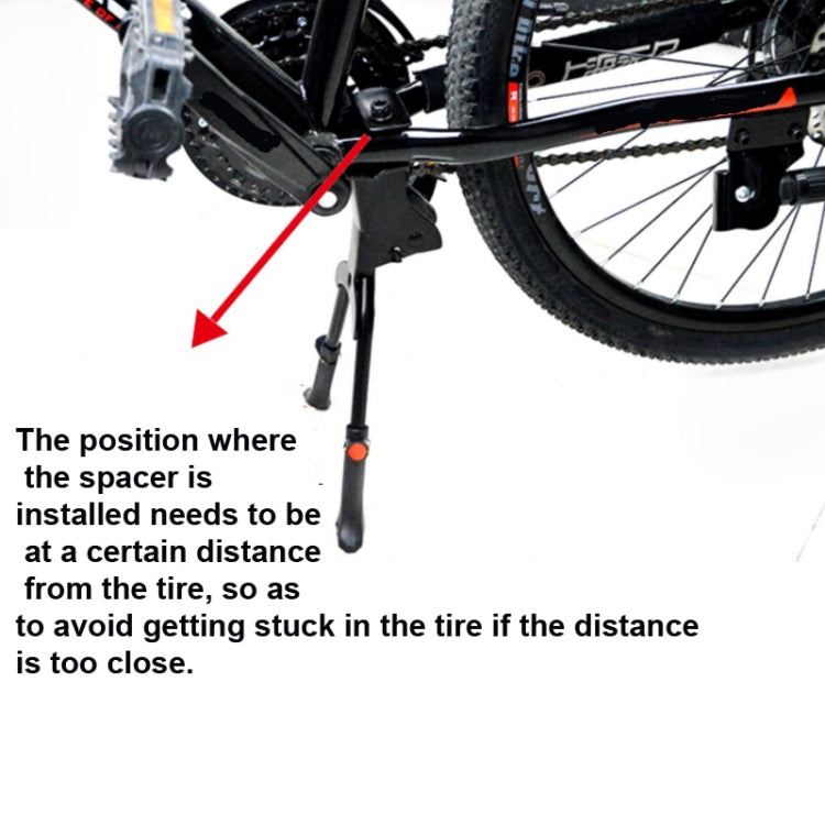 Bicycle foot support mounted near rear wheel with spacer to keep clear of tire