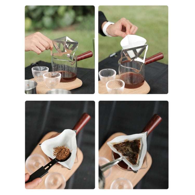 Stainless steel folding funnel holding a white paper filter with coffee grounds