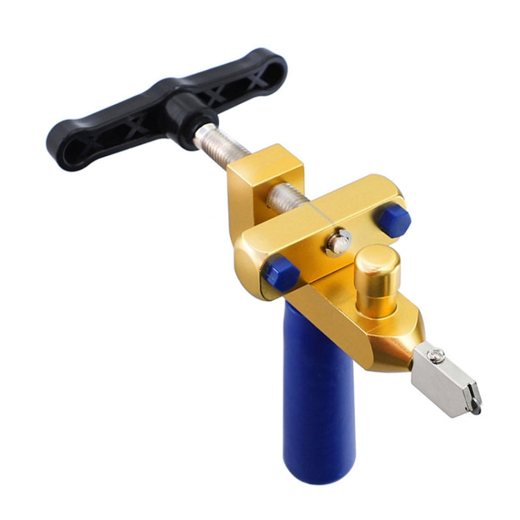 Handheld tile cutting tool with black handle, gold frame, and two metal cutting heads