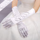 White long satin gloves with smooth cuff and five-finger hand coverage for formal wear