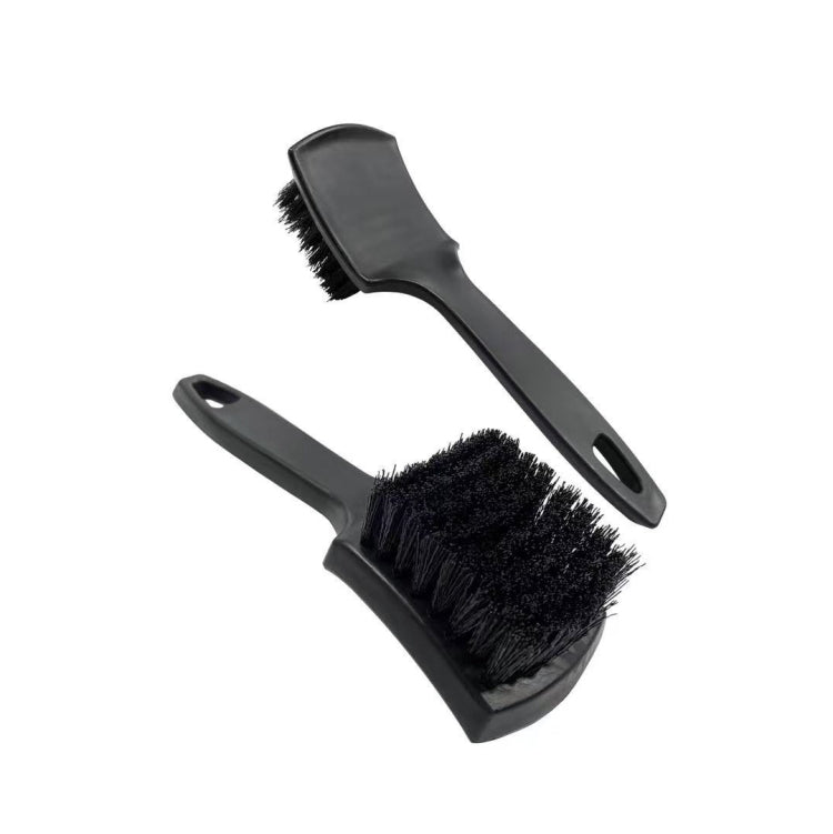 Black bristle tire and upholstery cleaning brush set with two angled heads and handles