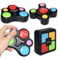 Black memory game controllers with colored pads, plus matching cube puzzle