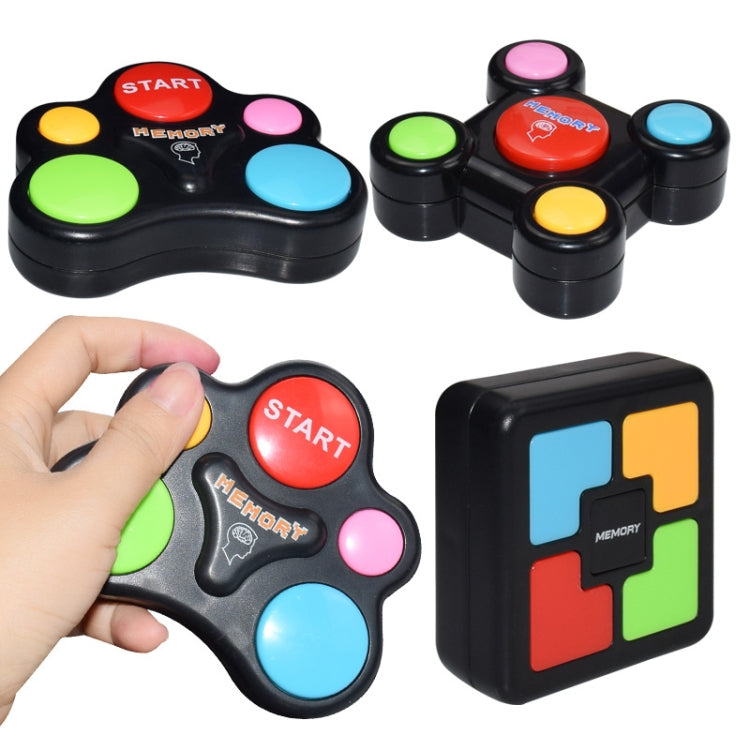 Black memory game controllers with colored pads, plus matching cube puzzle
