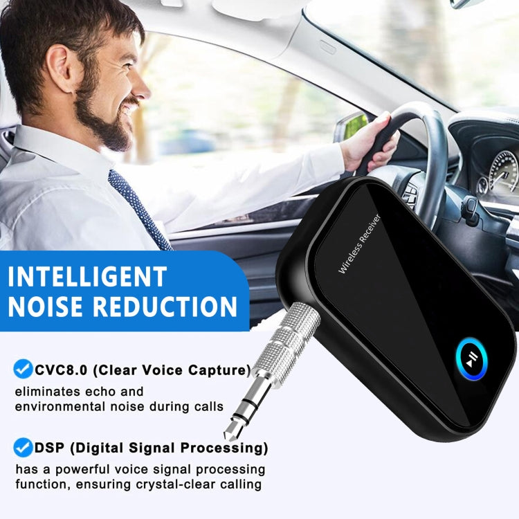 Black wireless audio receiver with 3.5mm plug near car dashboard, blue control button