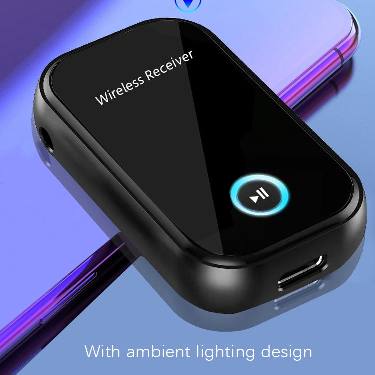 Black wireless receiver with USB port and blue control button, shown at an angle