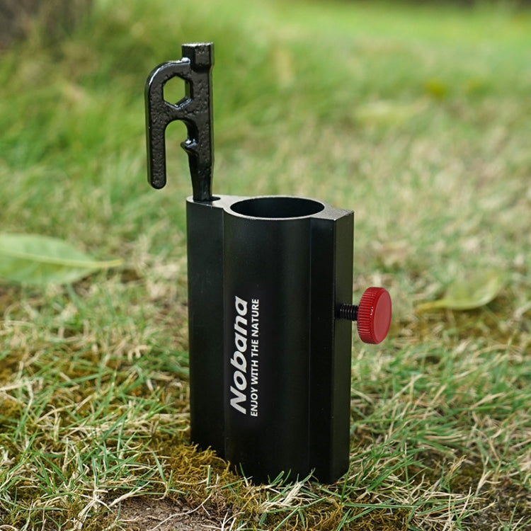 Black canopy pole holder with red knob and metal mounting bracket on grass