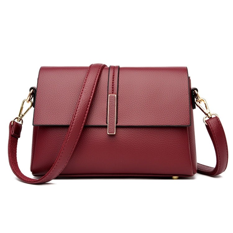 Red small square single-shoulder messenger bag with front flap and magnetic closure