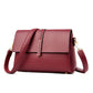 Red small square single-shoulder messenger bag with structured front flap and gold hardware