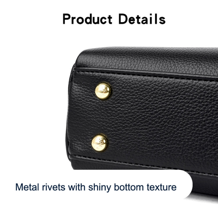 Black textured messenger bag with gold rivets on the front flap