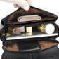 Black messenger bag open to show interior slots and zipper pocket