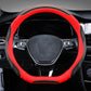 Leather steering wheel cover, black with red outer trim and contrast stitching on wheel rim